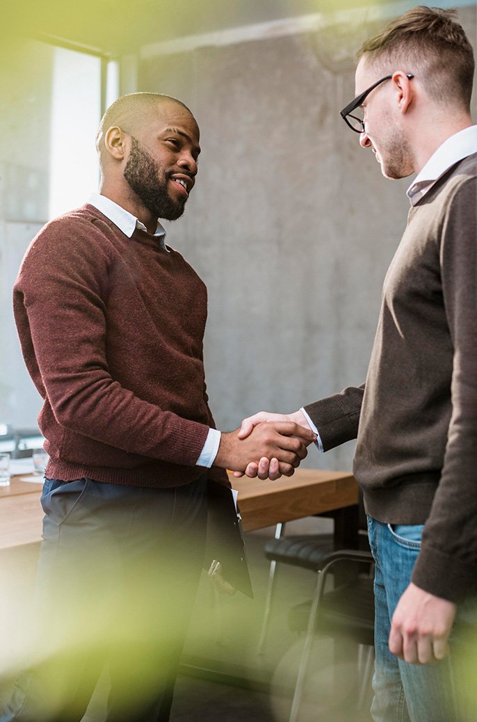 Men meeting with a handshake.