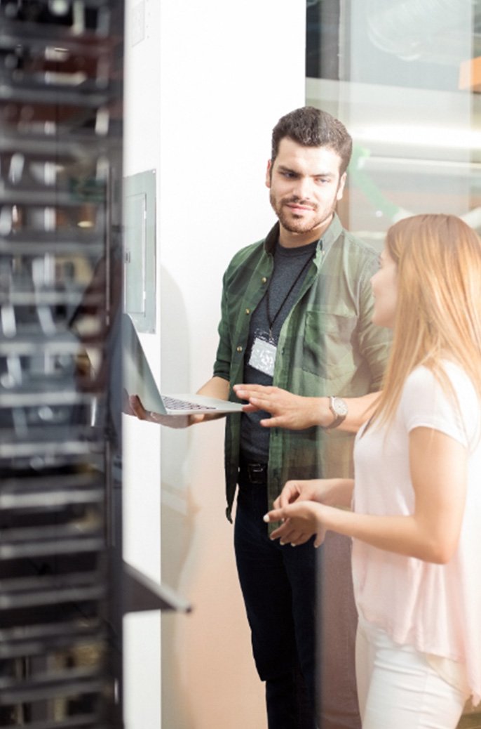 Man and woman in the server room.