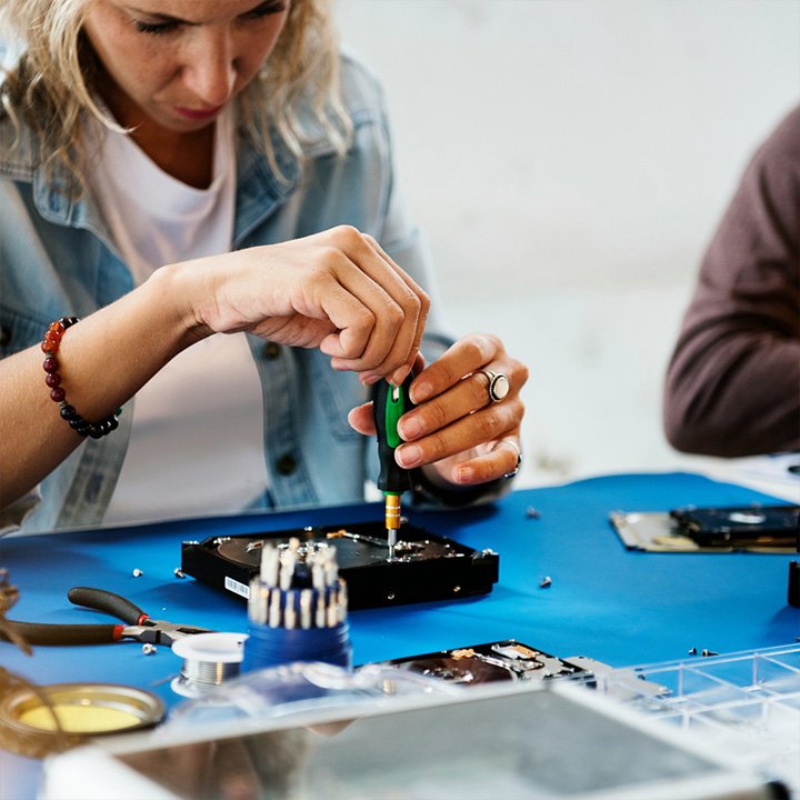 Woman assembling electronics.